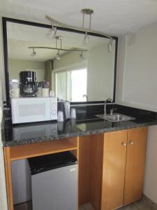 A kitchen or kitchenette at Surfer Beach Hotel