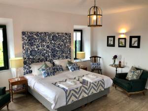 Posteľ alebo postele v izbe v ubytovaní Villa Vager Mani Hotel