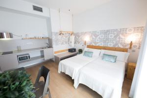 Posteľ alebo postele v izbe v ubytovaní Hotel Catalina