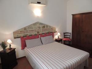 Postel nebo postele na pokoji v ubytování Agriturismo Il Cavallino Saturnia