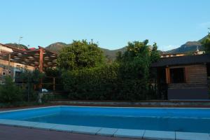a swimming pool in the backyard of a house at Desiderio D'Ammore in Corbara