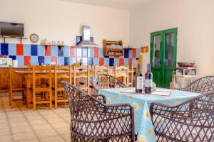 a dining room with a table and chairs at Casa Caleta Beach in Caleta de Caballo