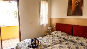 Posteľ alebo postele v izbe v ubytovaní Condominio Moschettieri + 17 fotografií