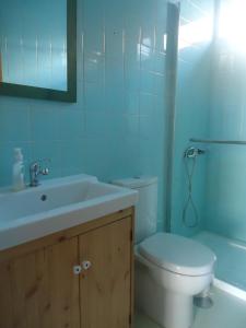 a bathroom with a sink and a toilet and a tub at One step from the beach, praia da Aguda in Arcozelo +12 photos