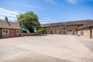 an empty driveway in front of a brick building at The Delaval Rooms in Lincoln