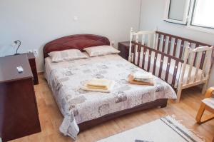 Säng eller sängar i ett rum på Traditional House Next to Ancient Olympia
