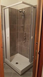 a shower with a glass door in a bathroom at podere la starza in Laureana Cilento +65 photos