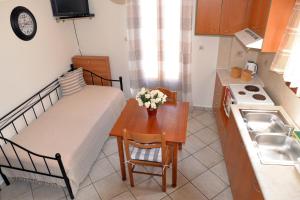 Kuchyňa alebo kuchynka v ubytovaní Ifigenia Apartments