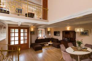 a living room with a couch and a table at Villa Guardian in Čilipi