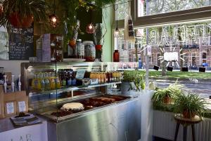 a food stand with food on display in a store at Little Duke Hotel in Den Bosch