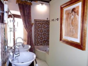 Bathroom sa Hotel Boutique Nueve Leyendas