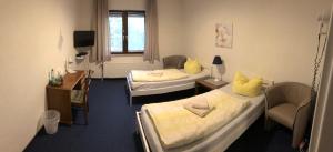 Postel nebo postele na pokoji v ubytování Hotel am Weißdornbusch + 20 fotografií