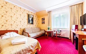 Łóżko lub łóżka w pokoju w obiekcie Karkonoski SPA - Bufet mini All Inclusive gratis!