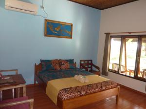 Tempat tidur dalam kamar di Java Lagoon