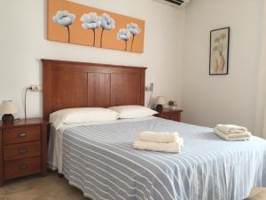 Giường trong phòng chung tại Es Lliri Blanc