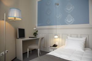 Postel nebo postele na pokoji v ubytování Rodopi Hotel