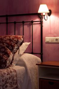 A bed or beds in a room at Hotel Sierra Quilama