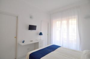A bed or beds in a room at Iris Amalfi Dreams