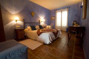 Un pat sau paturi într-o cameră la Hotel Sierra Quilama