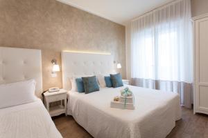 Postel nebo postele na pokoji v ubytování Hotel Soraya - Spiaggia Sawasdee with Beach & Parking
