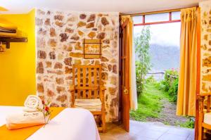 Rúm í herbergi á Hotel Kuntur Wassi