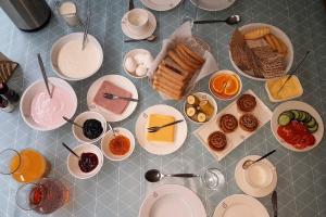 a table with many plates of food on it at Holt Inn in Flateyri