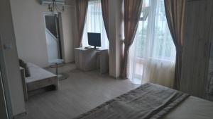 TV a/nebo společenská místnost v ubytování Guest House Adriya