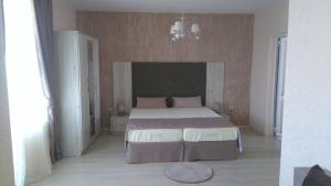 Postel nebo postele na pokoji v ubytování Guest House Adriya
