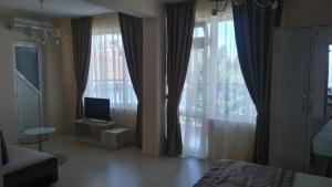 TV a/nebo společenská místnost v ubytování Guest House Adriya