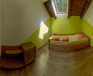 a bedroom with two twin beds and a window at Holiday House Vodice na Lazu in Strmica