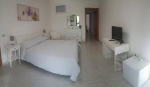 Krevet ili kreveti u jedinici u okviru objekta Hotel Falco D'oro