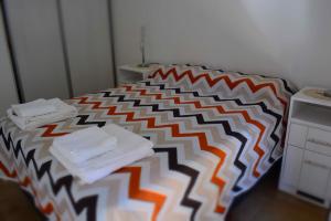 Кровать или кровати в номере Santorini 1