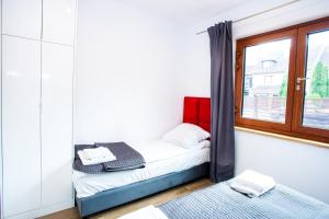 Katil atau katil-katil dalam bilik di Apartamenty SaltApart2