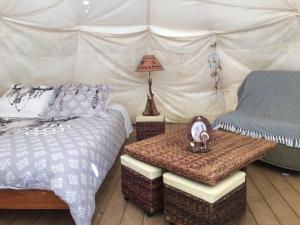 a bedroom with a bed and a table in a tent at Tipis nature in Gavarnie