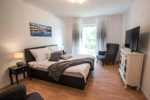 Letto o letti in una camera di Lake View Apartments
