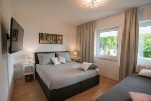 Llit o llits en una habitació de Lake View Apartments