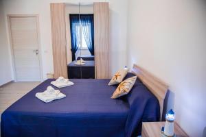 Posteľ alebo postele v izbe v ubytovaní Francesco B&B - Torre Canne