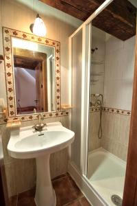 a bathroom with a sink and a shower at cuencaloft escapada al casco antiguo in Cuenca