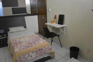 Postel nebo postele na pokoji v ubytování Hotel Calstar