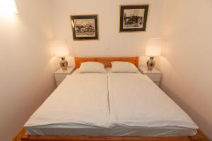 Postel nebo postele na pokoji v ubytování Apartma Spaans + 8 fotografií