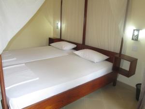 Voodi või voodid majutusasutuse Tandem Guesthouse toas