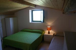 A bed or beds in a room at Casaleaurelia
