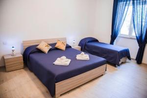 Posteľ alebo postele v izbe v ubytovaní Francesco B&B - Torre Canne