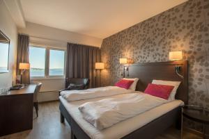 Tempat tidur dalam kamar di Thon Partner Hotel Victoria Hamar