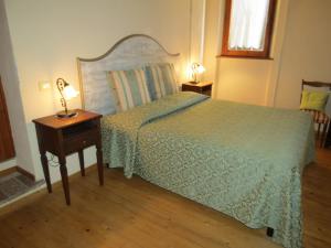 Postel nebo postele na pokoji v ubytování Agriturismo Borgo Del Papa