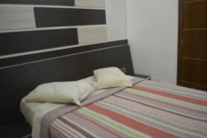 Postel nebo postele na pokoji v ubytování Hotel Calstar