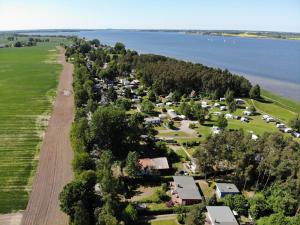 an aerial view of a village next to the water at Küstenferienhaus Nr. 91/92 in Stahlbrode