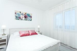 Posteľ alebo postele v izbe v ubytovaní Guest House Simoni