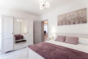 Posteľ alebo postele v izbe v ubytovaní Guest House Simoni