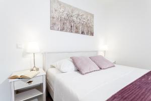 Posteľ alebo postele v izbe v ubytovaní Guest House Simoni